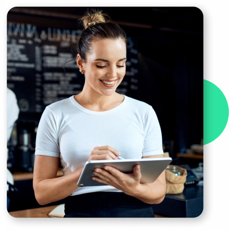 A female restaurant server uses a tablet to interact with the Harri Engage platform, a software solution designed to enhance the satisfaction and retention of frontline workers.